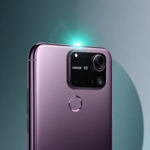 Close-up of Honor 400 Lite phone camera module with a glow around a distinct 'AI Camera Button' icon, emphasizing the AI feature. Background blurred with a soft, futuristic tech theme.